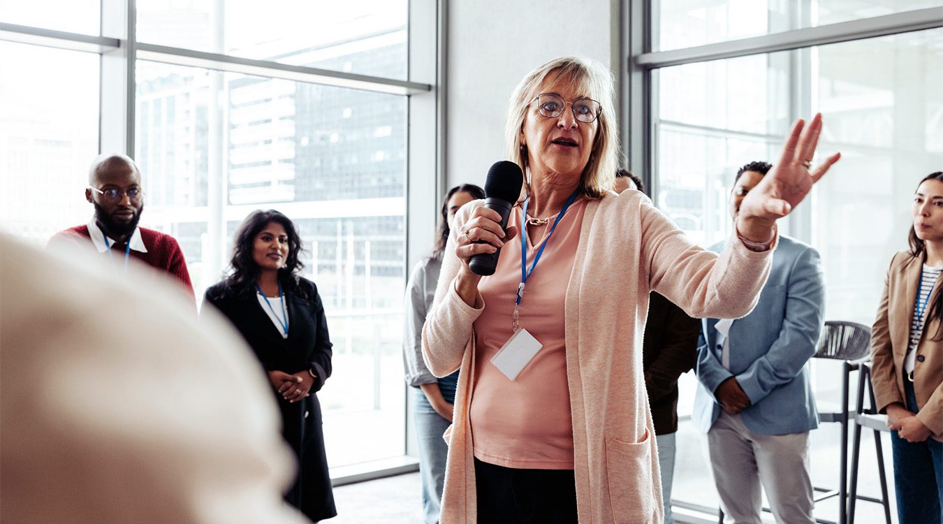 Executive speaking at a corporate conference