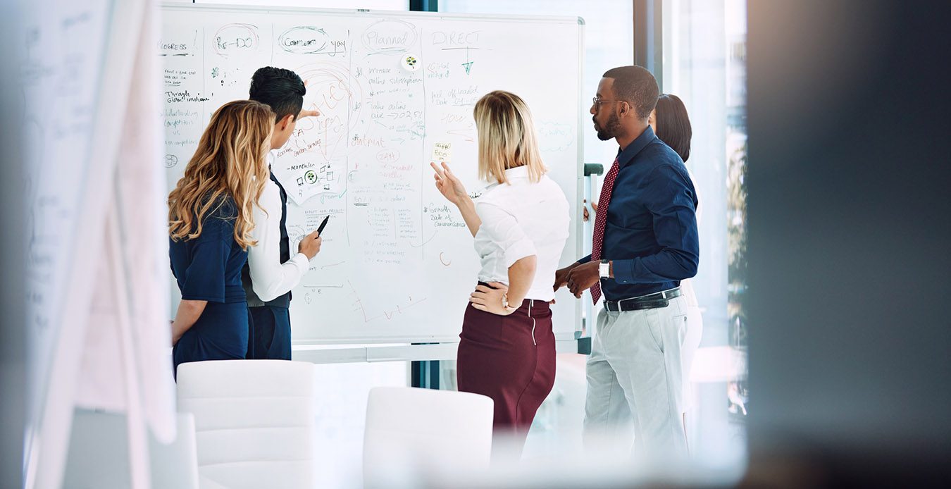 Trade association professionals working on their communications strategy